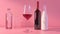 Elegant Assortment of Glass Bottles and Wineglass on Pink Background