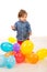 Elegant baby boy with balloons