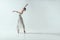 elegant ballerina dancing in studio