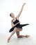 Elegant ballerina made a deflection. photo shoots in the studio on a white background