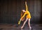 Elegant ballerina in pointe shoes dances with bouquet of tulips