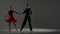 Elegant Ballroom Dance Couple on Spotlight.