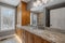 Elegant bathroom features luxurious granite countertops and sinks