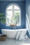 Elegant bathroom interior with a round bathtub and a large window