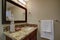 Elegant bathroom with a mahogany stained vanity