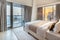 Elegant Bedroom of a High Rise Apartment Overlooking Marina During Sunset