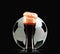 Elegant beer glass and soccer ball. Photo-realistic vector illustration of dark beer and football on black background.