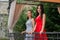 Elegant Best Friends: Fashionable Pose on a Restaurant Garden Balcony