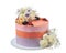 An elegant birthday cake of flowers and berries. On a white background.