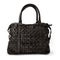 Elegant black leather woman`s handbag sewn from intertwined leather, isolated on white background, Women`s Fashion Bags