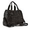 Elegant black leather woman`s handbag sewn from intertwined leather, isolated on white background, Women`s Fashion Bags