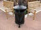 Elegant black metal trash can.