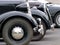 Elegant black vintage cars from the 1930s in a row