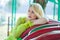 Elegant blonde fashion woman portrait in amusement park summe