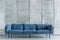 Elegant blue sofa in a modern Scandinavian-style interior