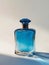 Elegant bottle of blue perfume.