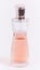 elegant bottle of pink eau de toilette on a white background. close-up  macro