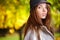 Elegant brunette woman in a park in autumn