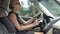 Elegant business lady learning how to drive car, trouble-free pregnancy, health