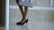 Elegant business woman legs passing security gate office building or hotel lobby