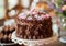 Elegant Chocolate Cake Decorated with Flowers on a Table