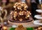 Elegant chocolate cake decorated with golden flowers