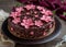 Elegant Chocolate Cake Decorated with Pink Flowers