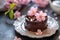 Elegant Chocolate Dessert Garnished with Pink Flowers