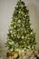 Elegant Christmas tree decorated with glistening glass balls and fairy lights.