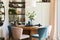 Elegant composition of stylish dining room interior design with velvet armchairs, design rounded wooden table and beautiful.