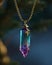 Elegant crystal pendant on a gold chain with a blurred background