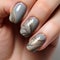 Elegant Dark Gray Nails With Gold And Grey Patterns