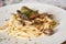 Elegant and Delicious italian pasta dishes served on a white plate in a restaurant. Food concept