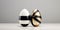 Elegant, designer inspired Easter eggs with a ribbon are showcased against a muted background. The luxurious mood can