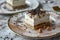 Elegant dessert serving of layered cake on a decorative plate