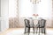 Elegant dining room interior with black wooden chairs around a marble table