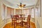 Elegant dinning room with hardwood floor.