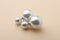 Elegant earrings with pearls on beige background