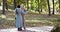 Elegant, elderly married couple in love dancing in autumn park