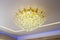 Elegant electric chandelier. Living room lighting concept