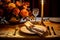 Elegant Fall Table Setting with Candlelight and Gold-Plated Cutlery
