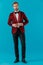 Elegant fashion man wearing red velvet tuxedo