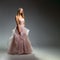 Elegant fashion. Stunning woman in elegant long dress in studio. Luxury evening fashion. Glamour fashion model. Elegance