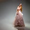 Elegant fashion. Stunning woman in elegant long dress in studio. Luxury evening fashion. Glamour fashion model. Elegance