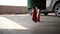 Elegant female legs walking to parked car