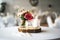 Elegant festive table setting with colorful flowers and candle on wooden stand. Wedding table decoration.