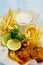 Elegant fish and chips with lemon slices and tartare sauce