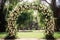 elegant floral arch for a verdant park wedding