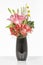 Elegant flower arrangement in beautiful vase isolated in a bright white studio