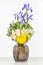 Elegant flower arrangement in beautiful vase isolated in a bright white studio